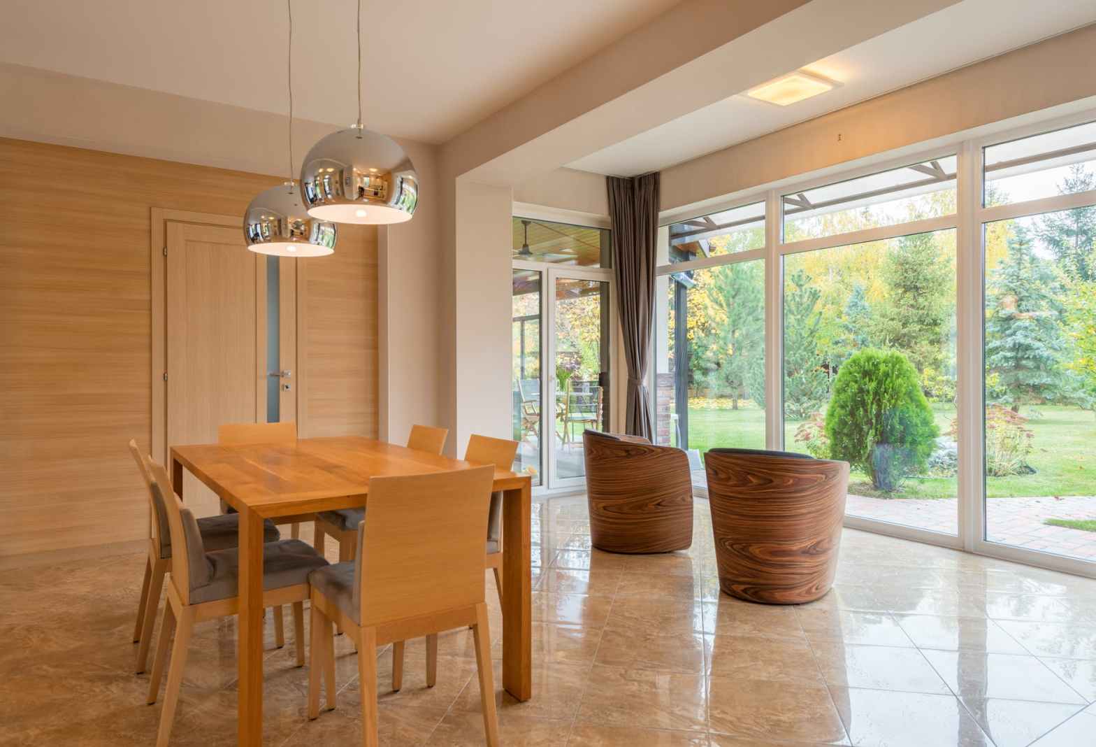 Dining Room with dropped beam visually separating it from seating area