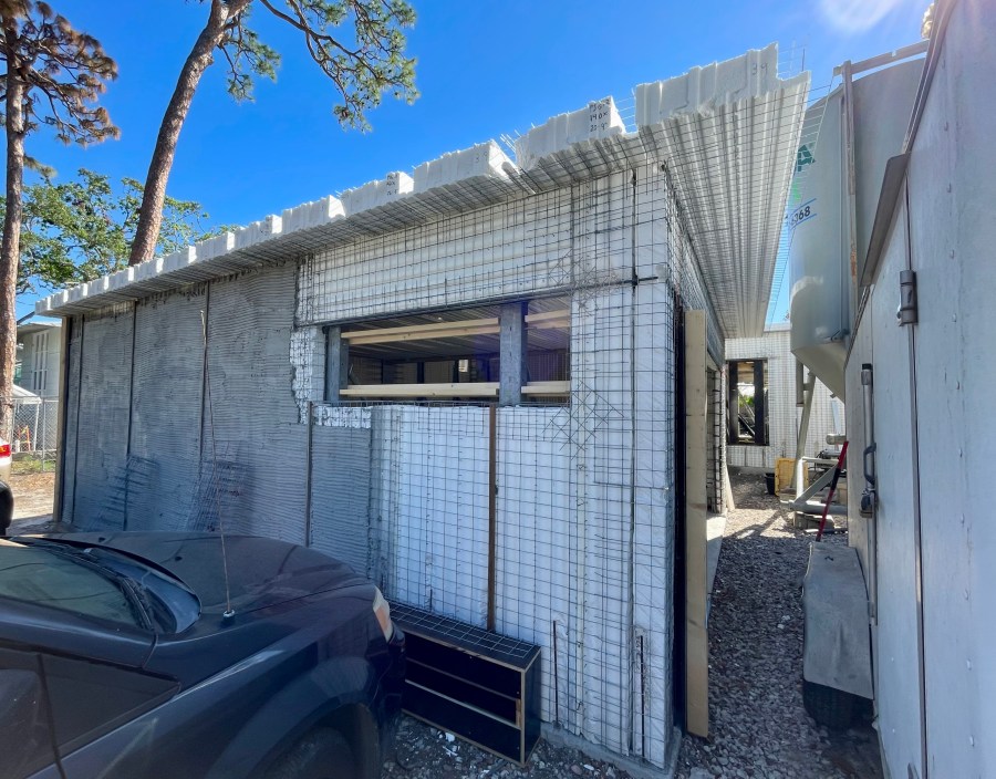 house under construction with walls and roof built of SCIPs Structural Concrete Insulated Panels