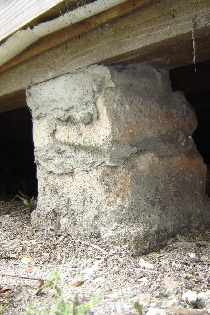 stone pier supporting the house above