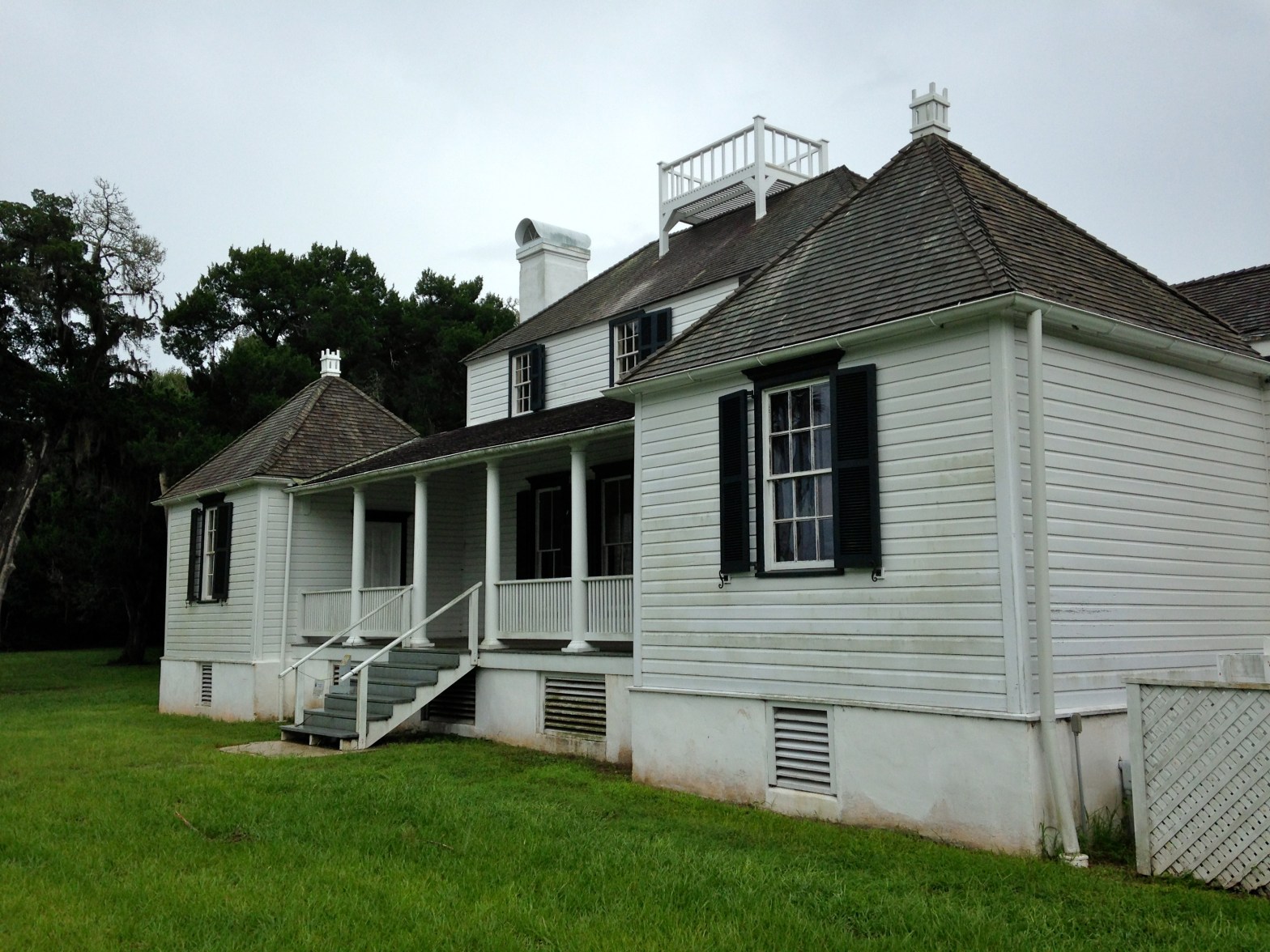 historic house raised above crawl space with large vents centered under windows
