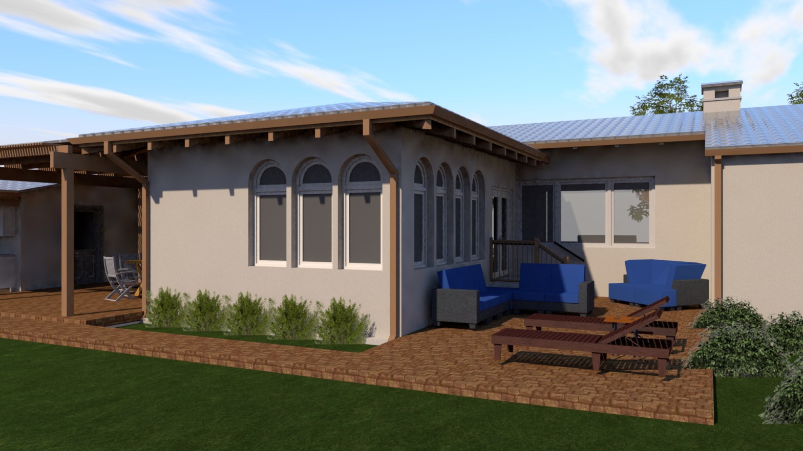 Renovation showing series of arched windows on outside wall of home with patio either side