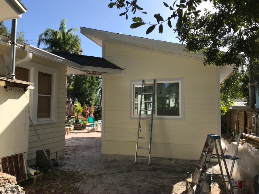 Project nearing completion with ladders still in use.