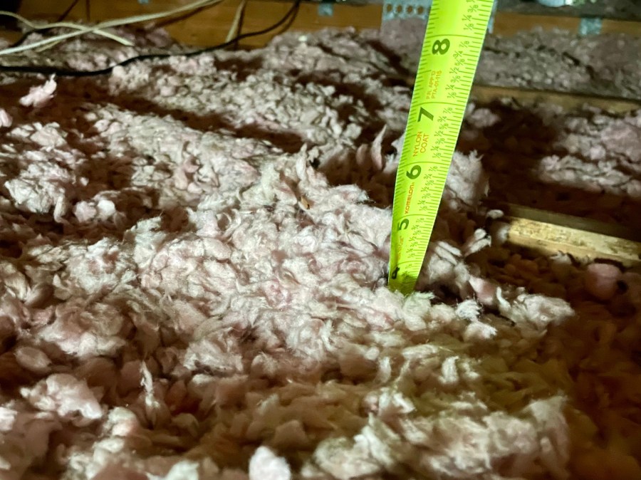 Uneven attic insulation resembling rolling hills in Florida home
